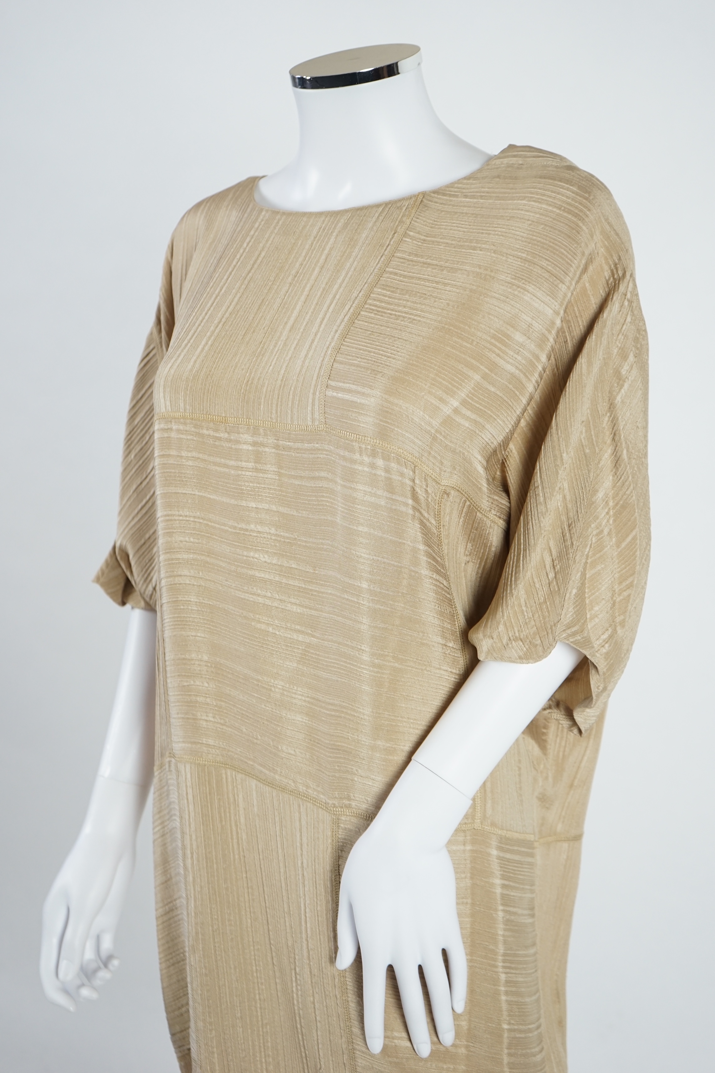 A La Perla white trouser lounge suit, a black jacket lounge jacket, a fawn silk dress and a white embroidered shirt dress. Approx Size L Proceeds to Happy Paws Puppy Rescue